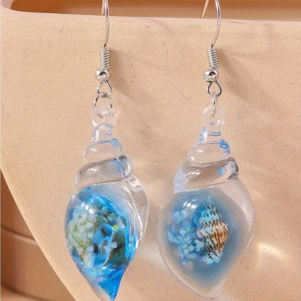 Hand crafted glowing seashell dangle earrings